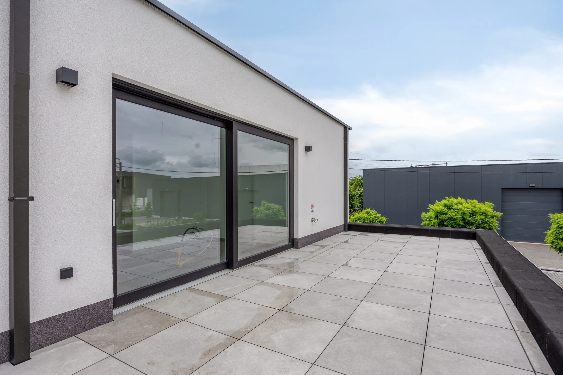 Privé dakterras met schuifdeuren